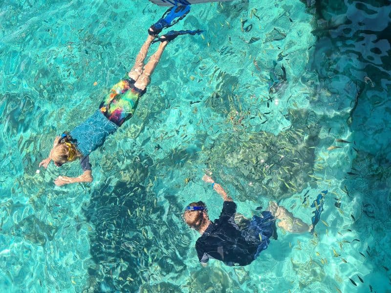 Our kids surrounded with fish while snorkelling in Indonesia.