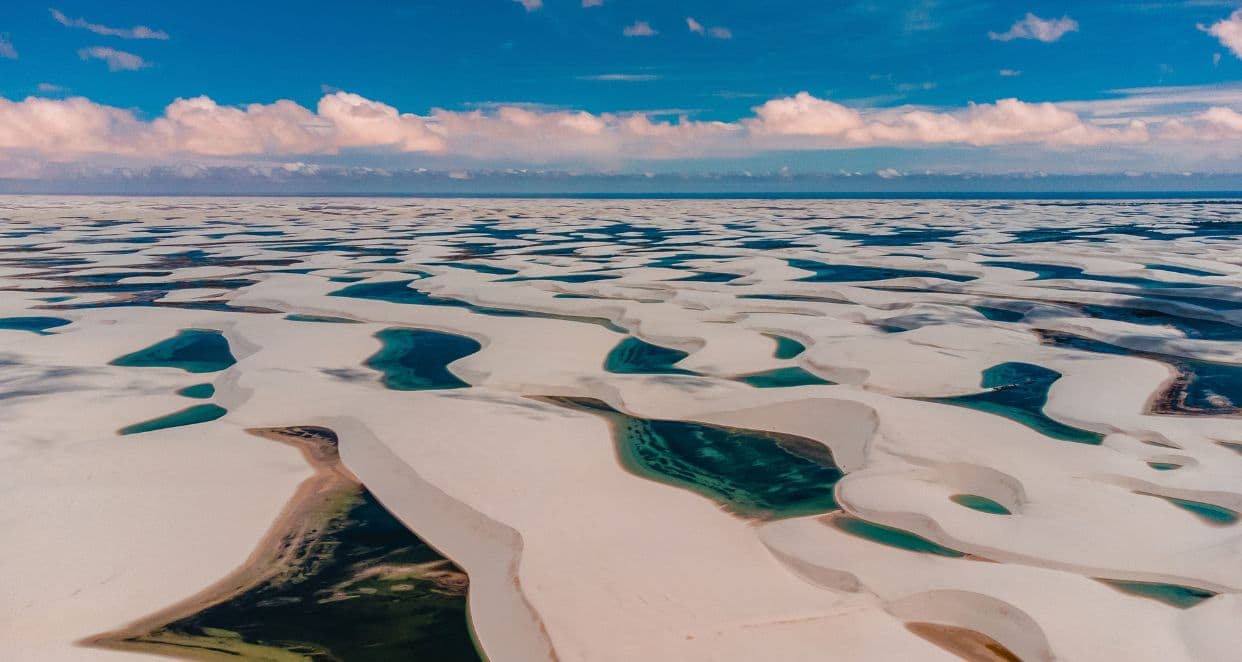 Sand dunes with pockets of clear blue water. Lencois Maranhenses NP