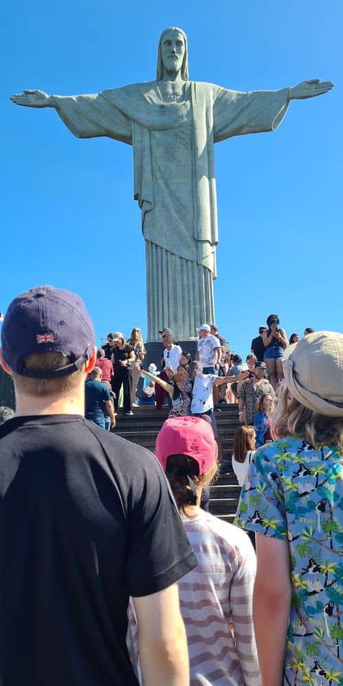 KIds viewing a tall iconic statue in Rio-de-Janeiro, Brazil with kids