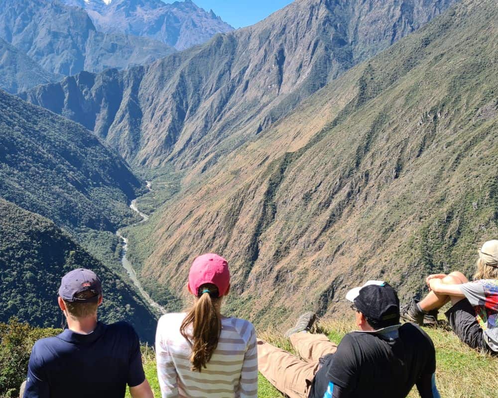 Trekkers on the Inca Trail soaking up the stunning landscapes. A good reason to trek the Inca trail with kids