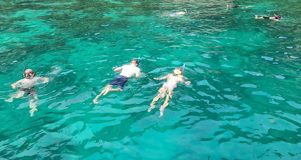 Our kids snorkelling in one of the best destinations in Phi Phi, Thailand.