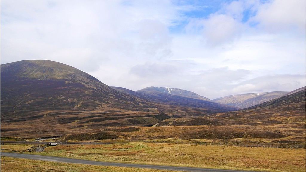 The Cairngorm mountains near Dalwhinnie in Scotland by 13threephotography from Getty Images. A popular place to hike in Scotland.