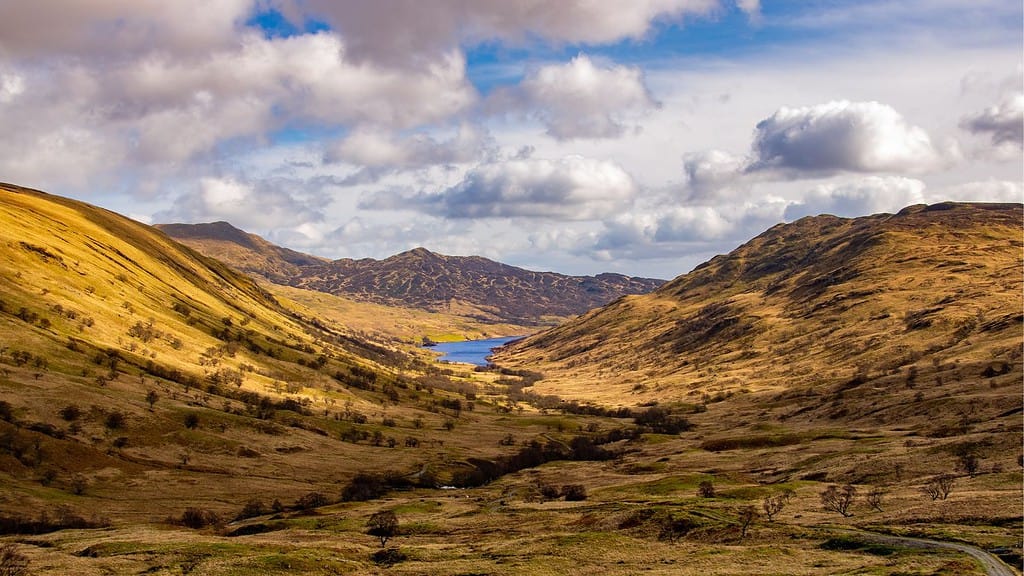 Valley view towards a mountain range for hiking in Scotland.