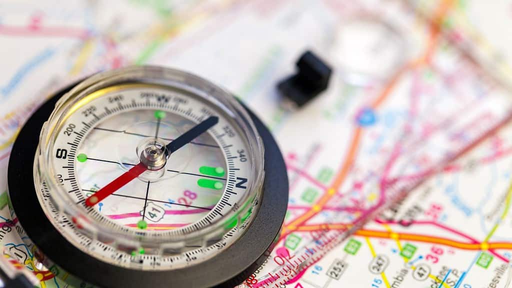 A compass and map for navigating hikes safely 