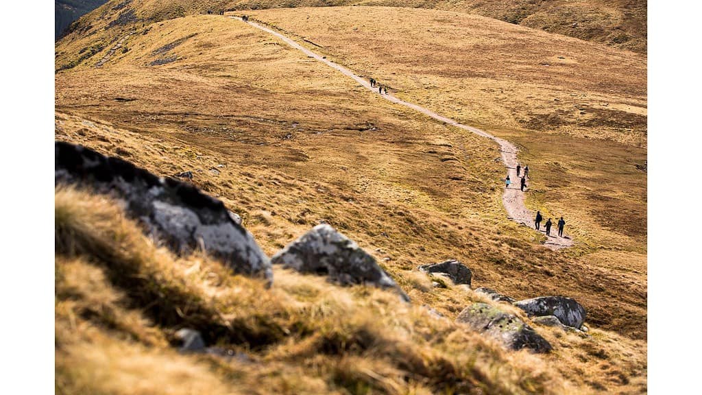 hikers walking a path leading to Ben Nevis, Scotland