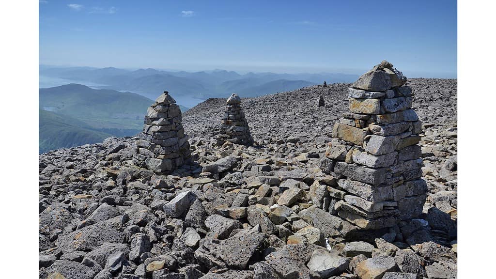 stoney area on a mountain with several cairns.