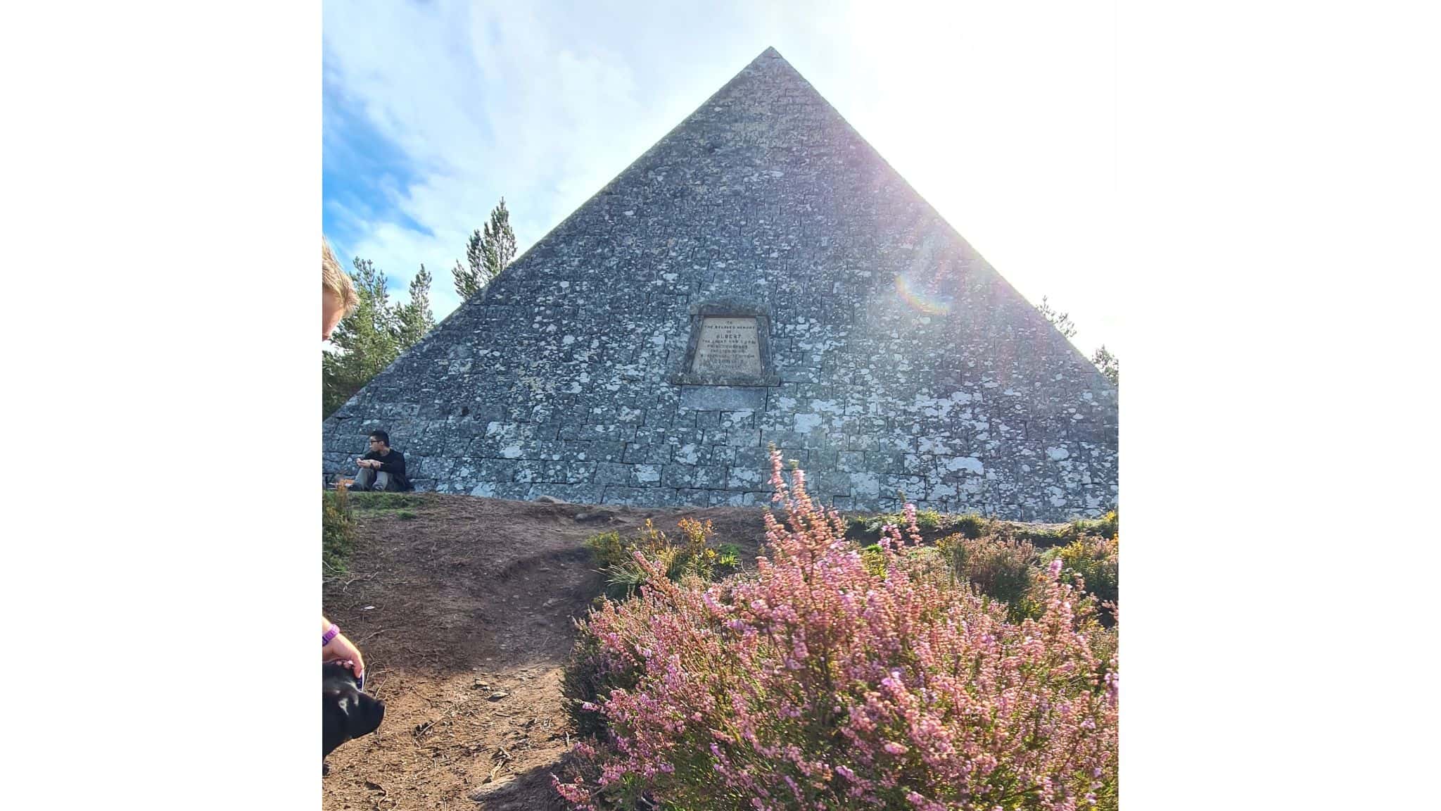 Pyramid memorial with heather in the foreground 