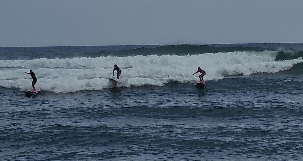 Kids riding the waves in Sri Lanka. 