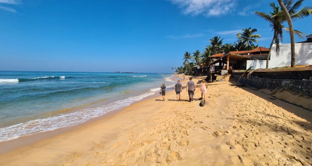 Hikkaduwa beach with kids. A popular surf destination in Sri Lanka.