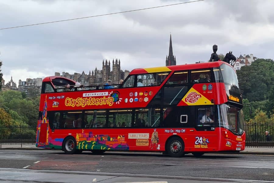 Red open top sight seeing bus. A great tour to see Edinburgh in a day.