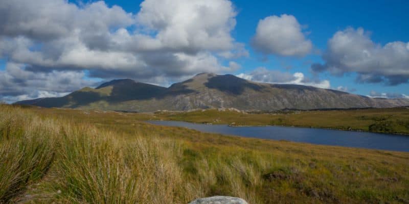 Highlands view along the North Coast 500 on a sunny day in Scotland perfect road trip idea for a family.