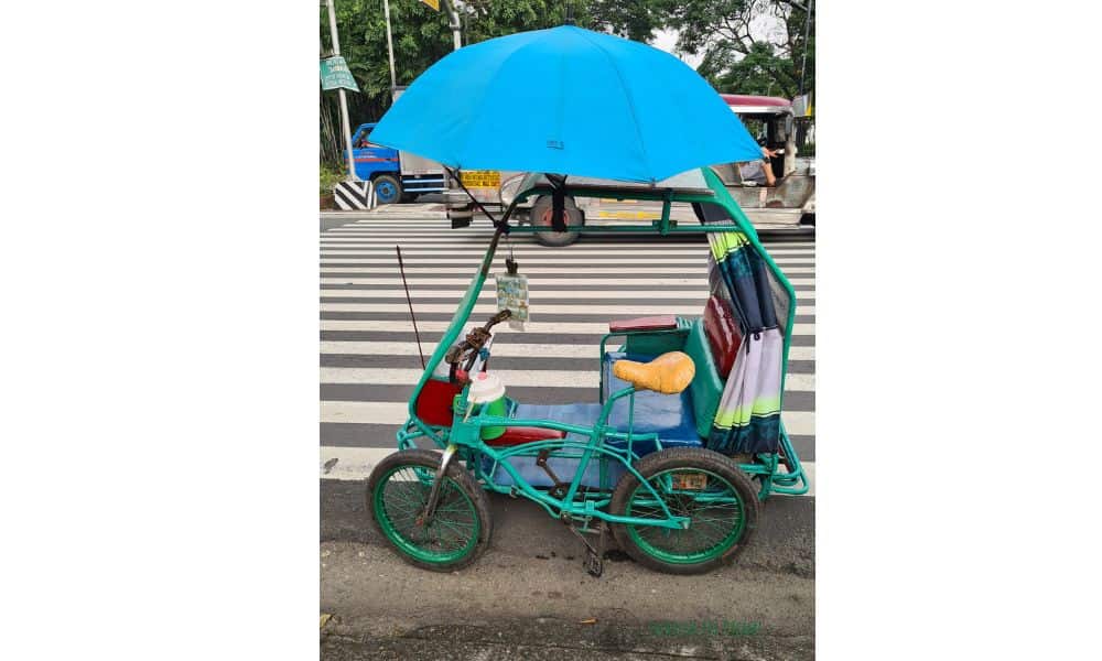 Tuk Tuk style Rickshaw transport waiting at the roadside. An affordable way to travel with kids.