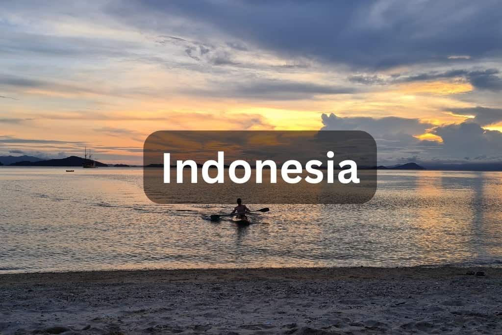 Sea view with kid kayaking at sunset with the words Indonesia