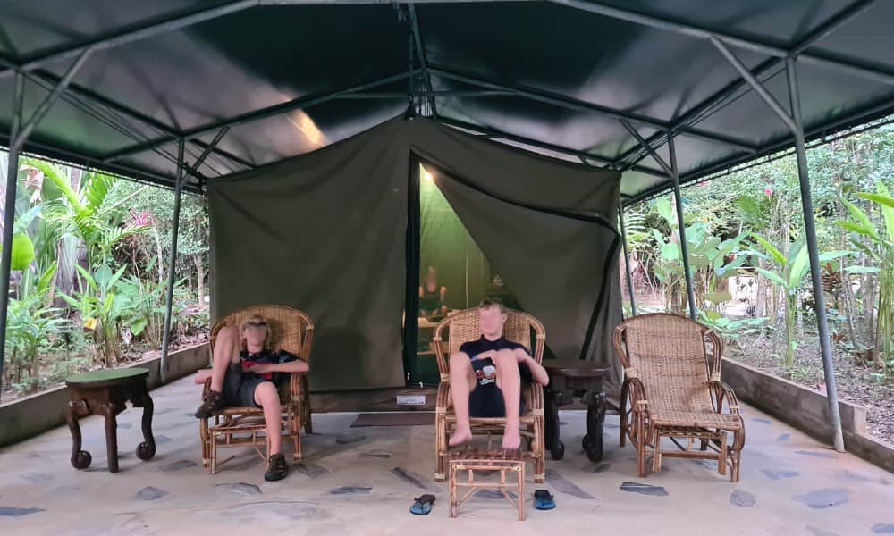 Kids sat in a tent. A unique experience at Elephant Hills in Thailand