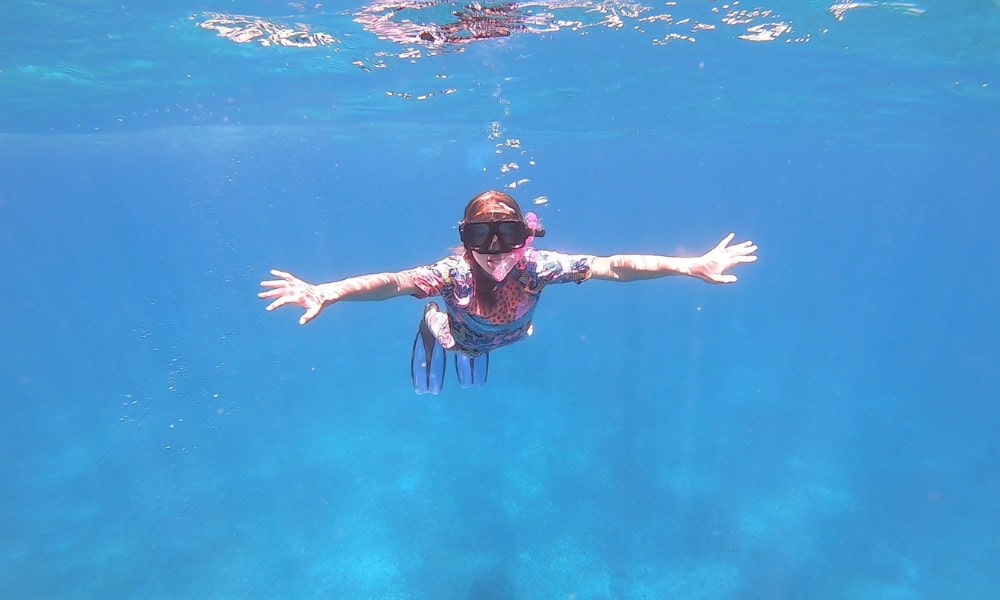 kid snorkeling in the ocean