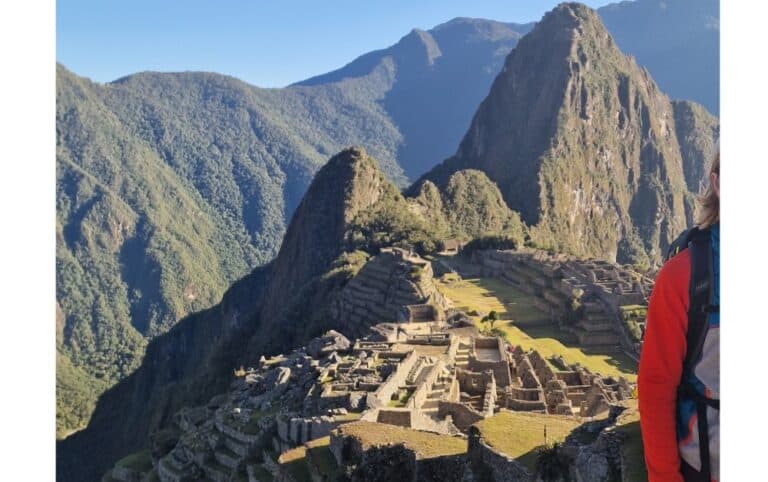 An ancient citadel built by the Incas on a hill in Peru surrounded by tall hills. Machu Picchu is a must see natural wonder to appreciate it for yourself.