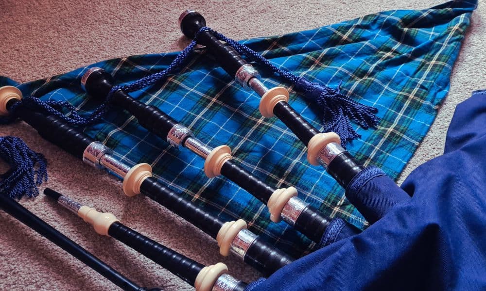 A set of blue bagpipes, traditionally played in Scotland.