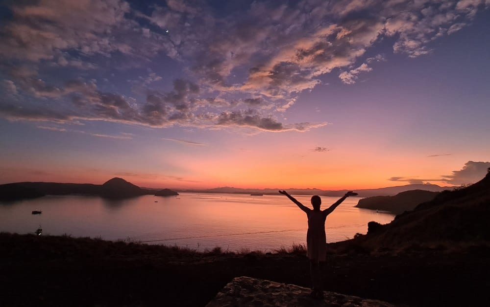 Purple and orange sky at dawn in Padar island. This is a popular stop on a Komodo Island tour.