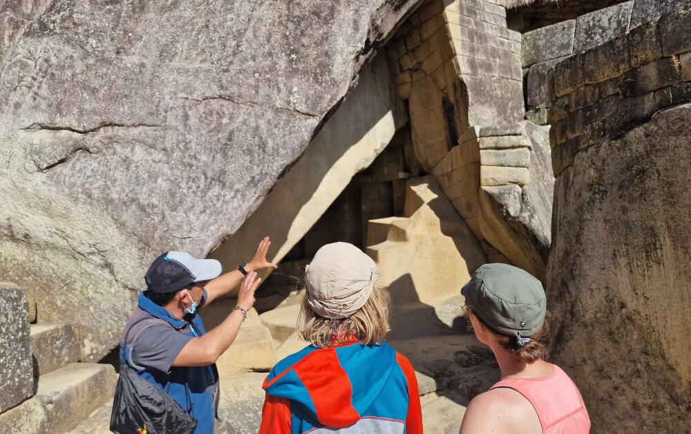 Trekking the Dream family being guided round Inca ruins at Machu Picchu, Peru