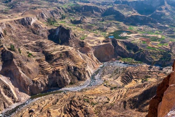 Massive rocky canyon with a river.