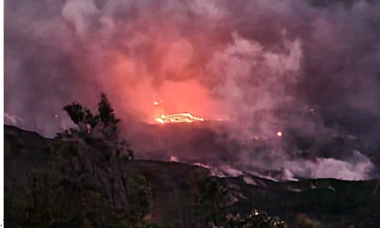 A distant glow at night of the most active volcano on Hawaii.