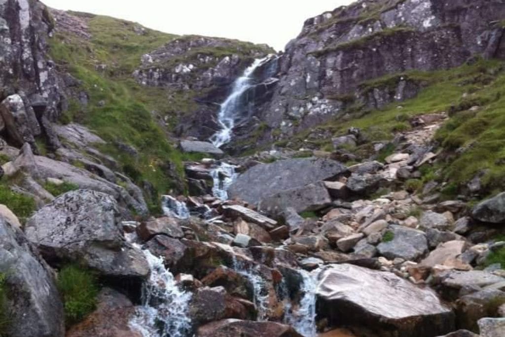 Waterfall over rocks on Ben Nevis, Scotland.