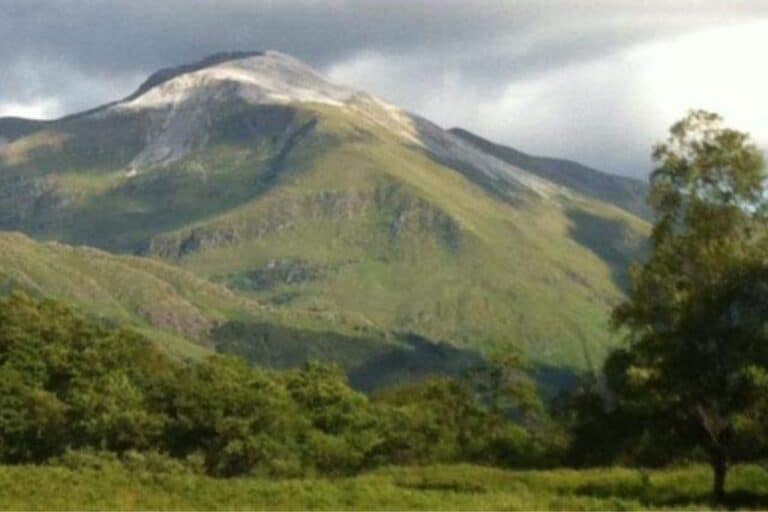 Iconic green mountain view with snow on the summit of Ben Nevis, Scotland