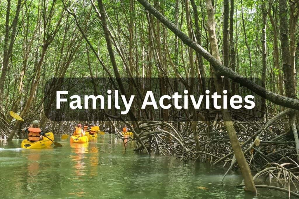 Trekking the Dream Family Adventures with kids kayaking through mangroves. 