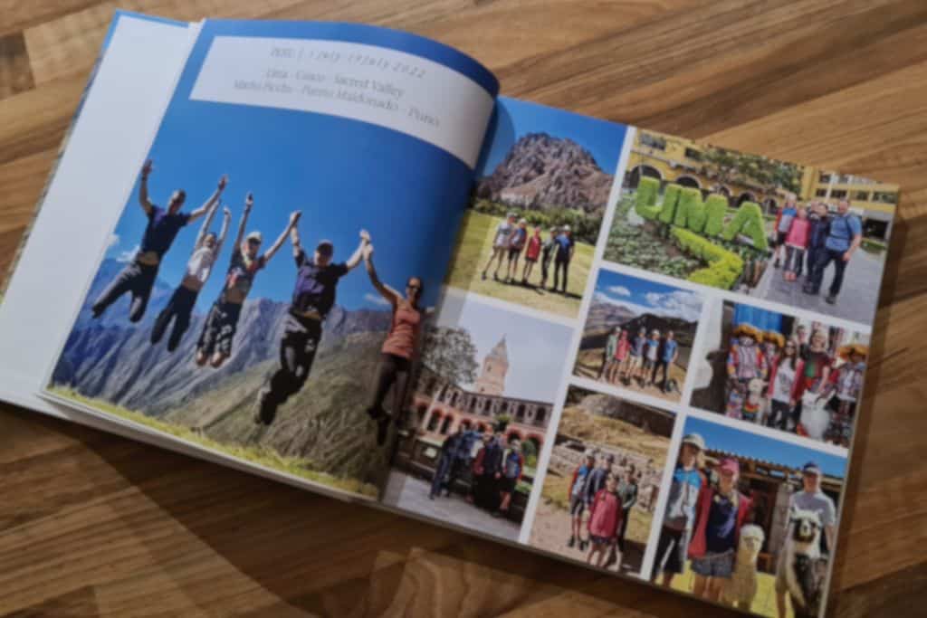 Open photo book of colourful family travel photos.