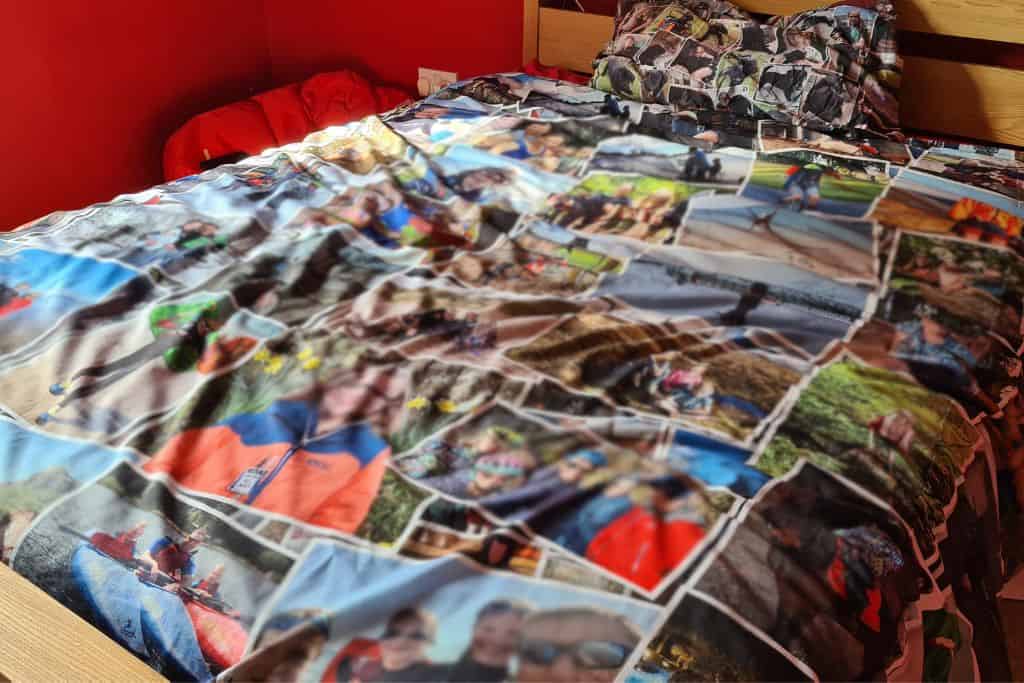 Family photos displayed on bedding as a gift.