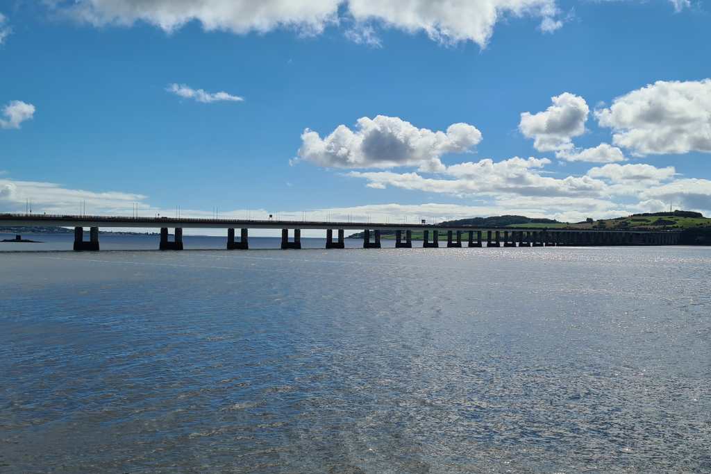 Road bridge over water with blue sky in Dundee.