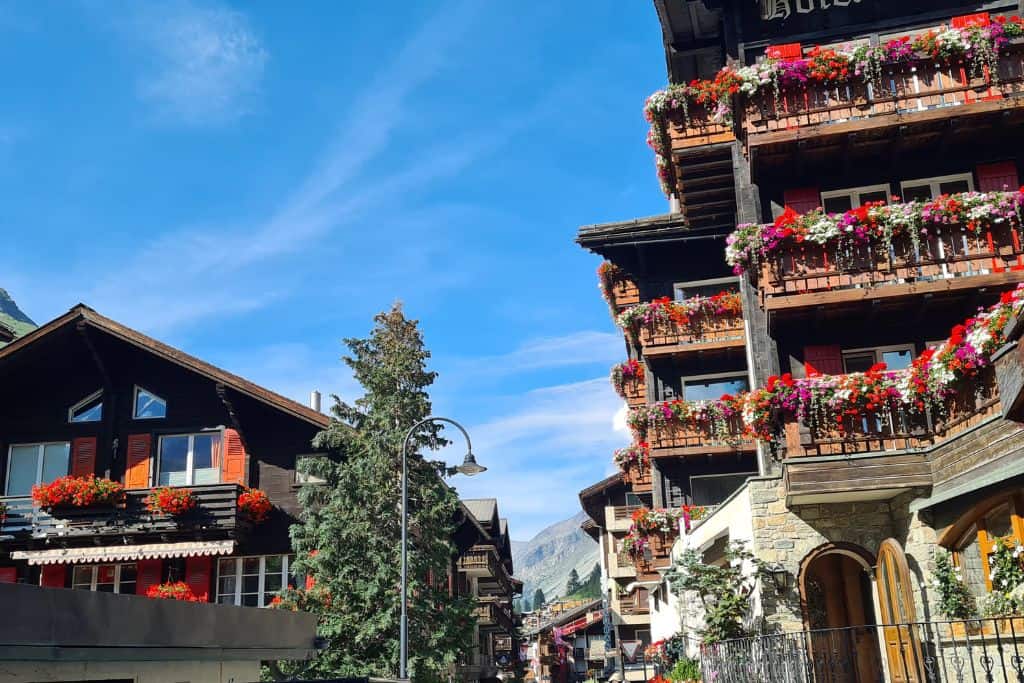 Wooden chalets decorated with flower boxes. 