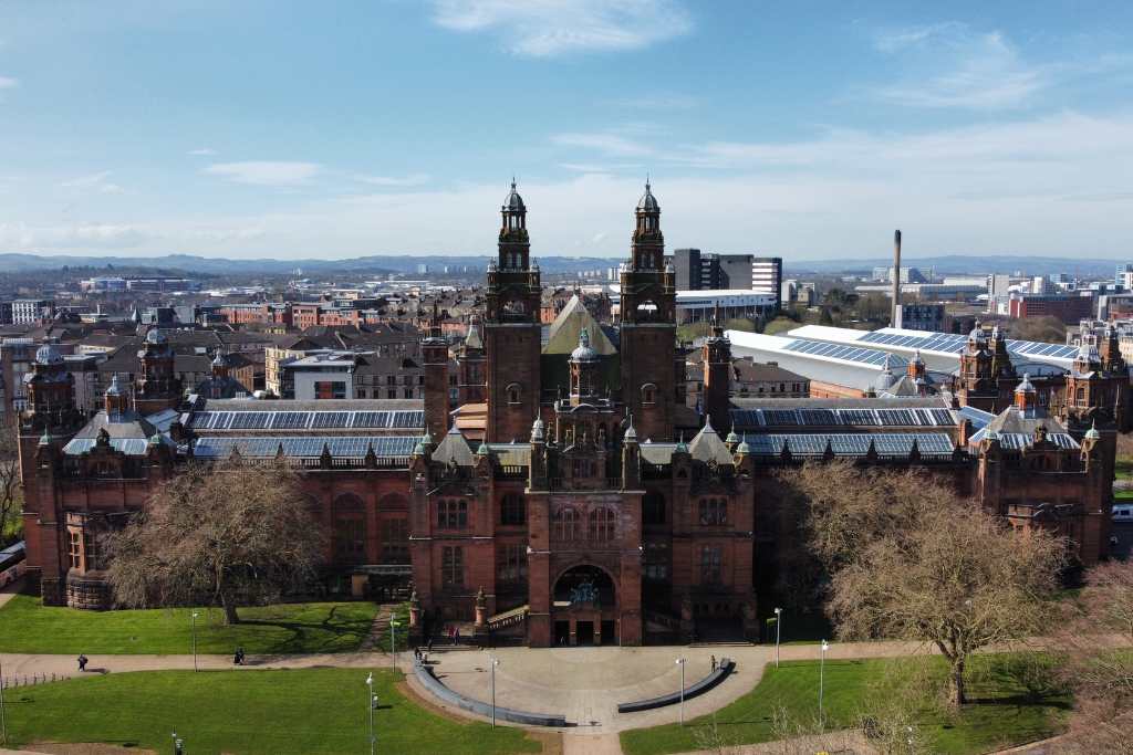 Large gothic building with spires in a city