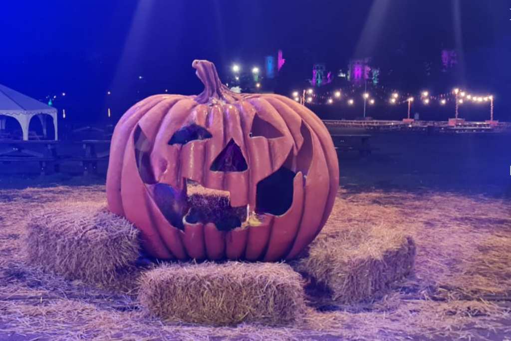 Large creepy pumpkin on a farm for halloween.