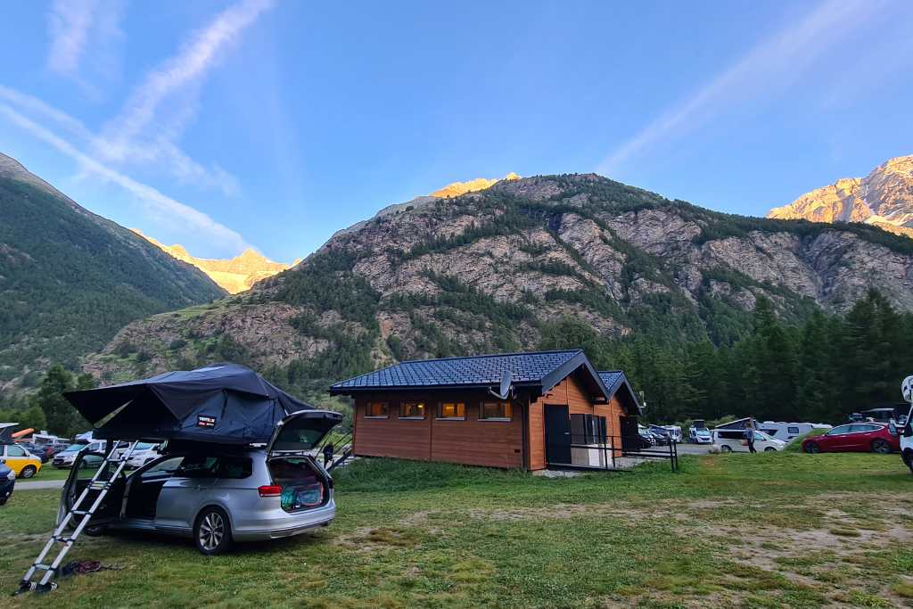 Campsite with a TentBox rooftop tent  and mountains as the sunrises.