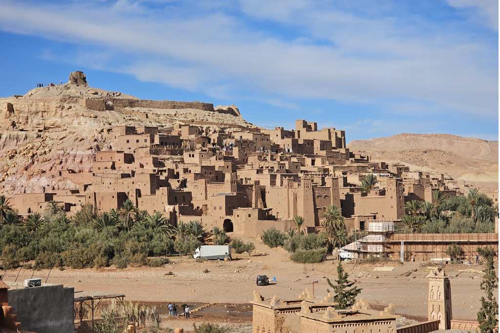 City of mud brick houses on a hill. Ben Ait Haddou is a popular traditional Kasbah worth seeing on a Moroccan itinerary with kids.