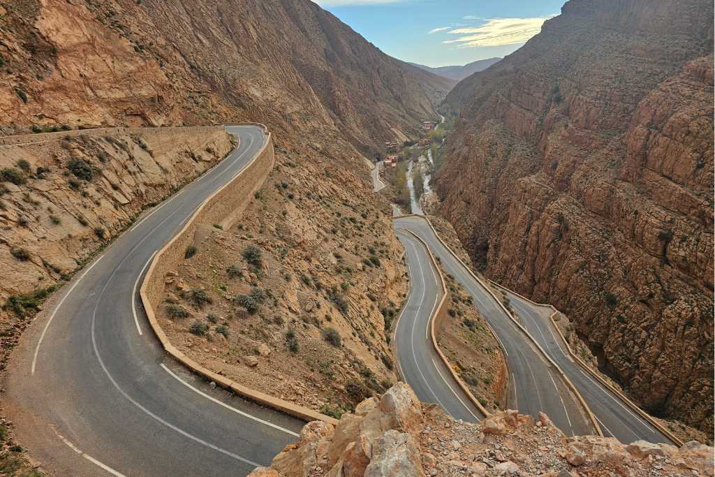 Road switchbacks leading up a rocky canyon. A popular viewpoint along Dades Gorge Morocco.