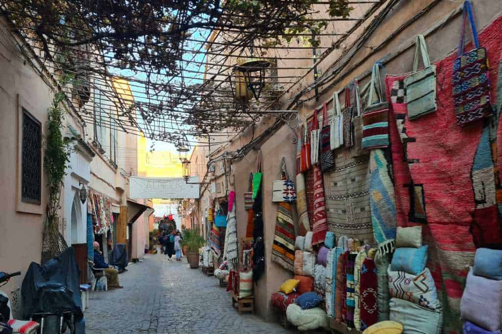 Colourful market in an alleyway in a medina in Morocco. Lots of  traditional goods waiting to be purchased in Marrakesh.