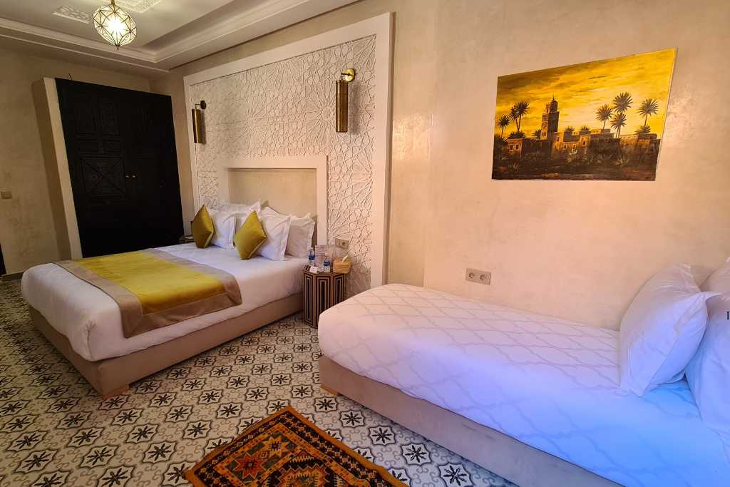 A family room with two bed in a tradition riad style hotel in Marrakesh.