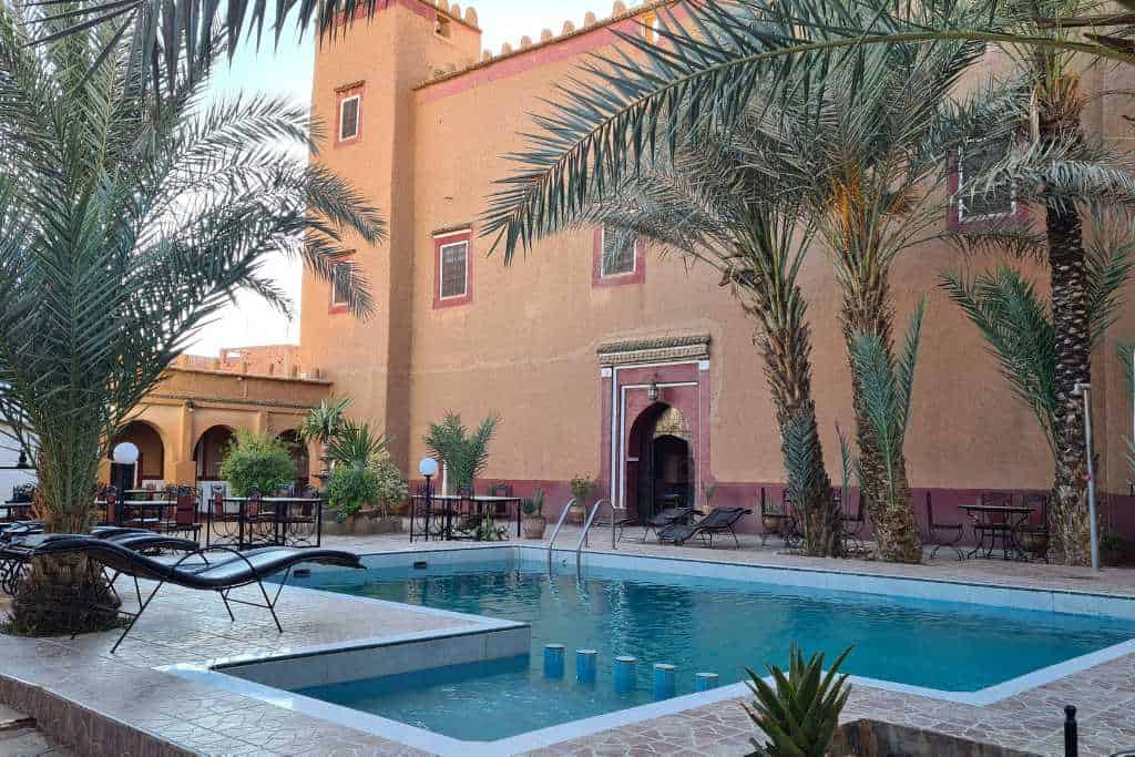 Outdoor swimming pool in the court of a riad in Morocco. A perfect place to stay when travelling with family.