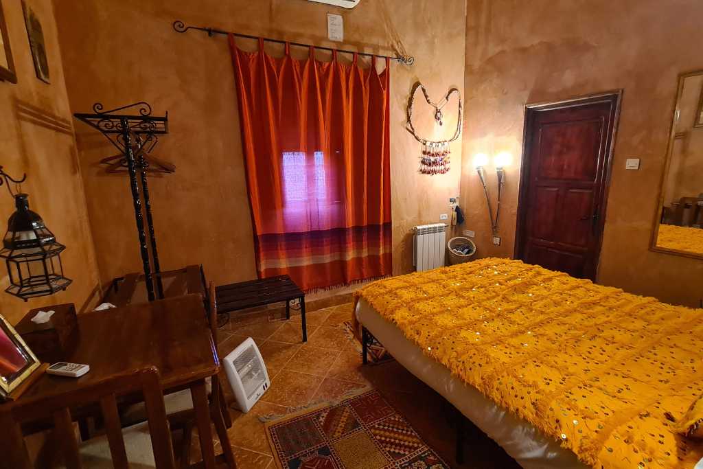 A traditional riad double bedroom with a window. 