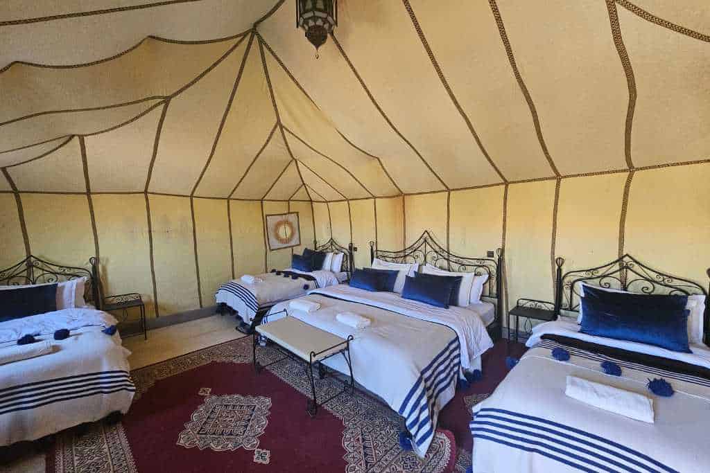 A luxury tent with beds popular for people to stay in in the Sahara desert.