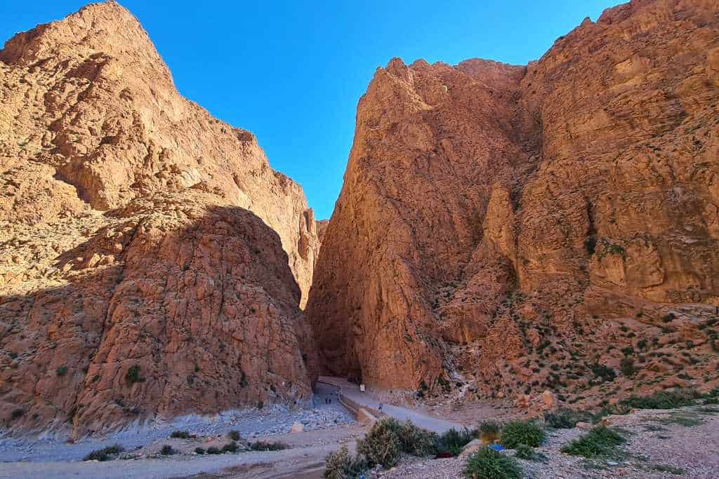 Large rock canyon with a road running through. A popular stop on a road trip in Morocco.