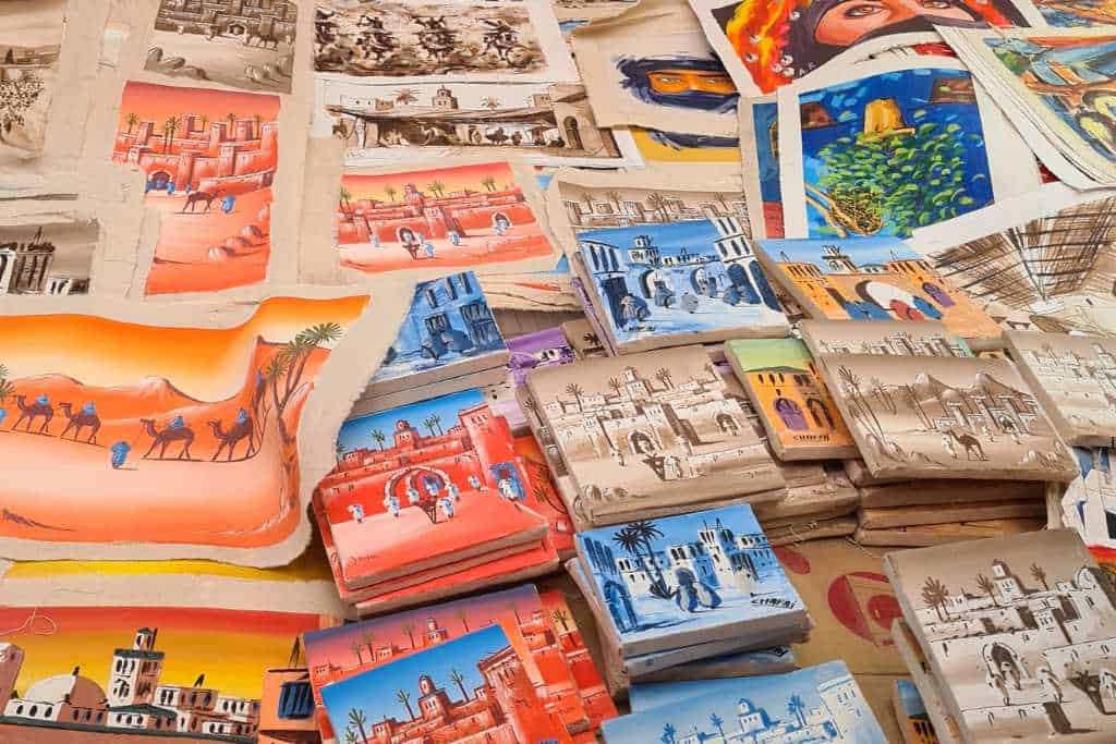 A selection of colourful mini canvas paintings illustrating sights in Morocco.